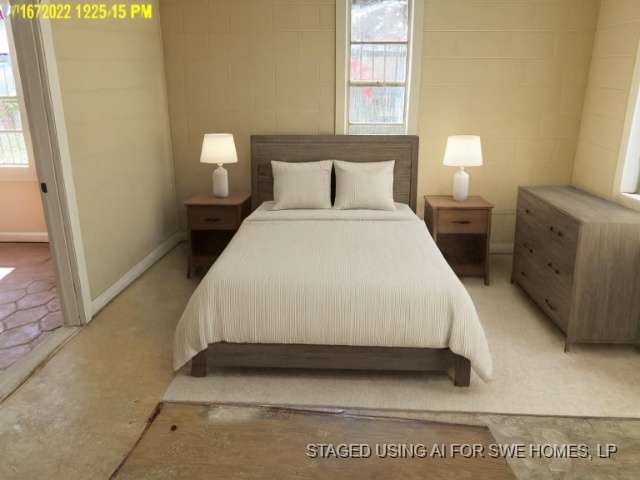 9583 South 3rd St Road Waco, TX 76706 - Photo 7 of 12 a bedroom with a bed and a night stand