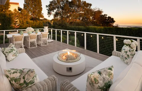 a view of a deck with furniture