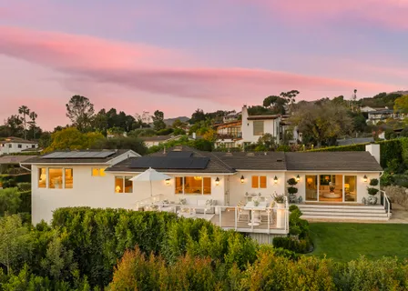 an aerial view of house with yard swimming pool and outdoor seating