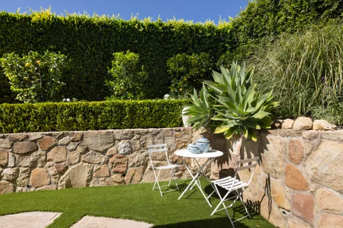 a view of house with deck and outdoor seating