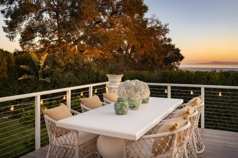 a terrace with a table and chairs