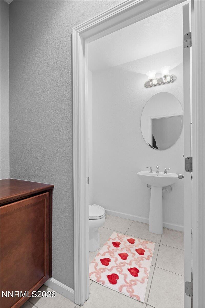 2190 Bears Ranch Drive Reno, NV 89521 - Photo 11 of 23 a bathroom with a sink and a mirror