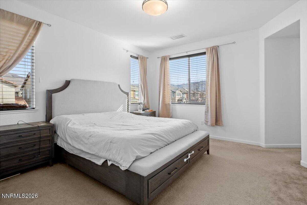 2190 Bears Ranch Drive Reno, NV 89521 - Photo 14 of 23 a bed sitting in a bedroom next to a window