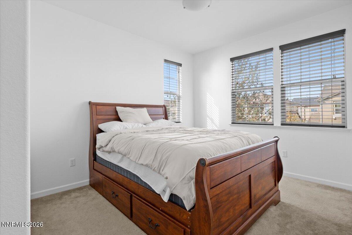 2190 Bears Ranch Drive Reno, NV 89521 - Photo 16 of 23 a bed sitting in a bedroom next to a window