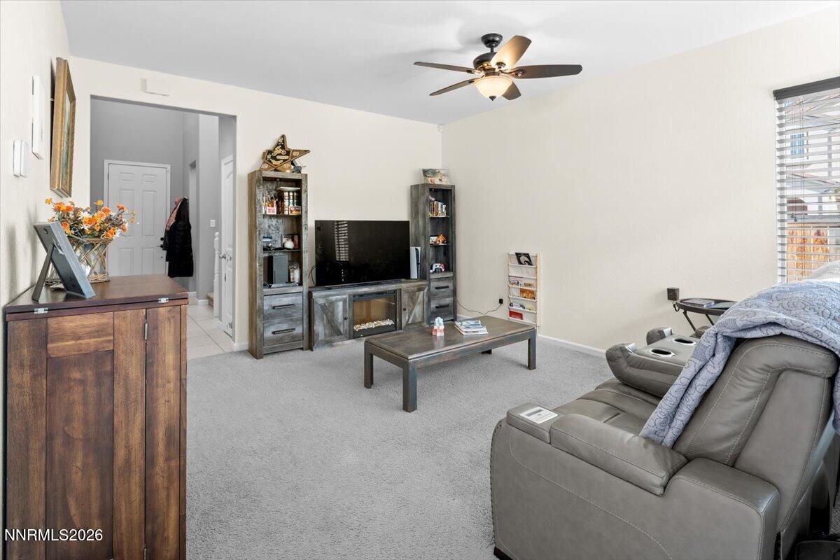 2190 Bears Ranch Drive Reno, NV 89521 - Photo 4 of 23 a living room with furniture a flat screen tv and a window