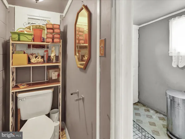 a bathroom with a toilet and a sink