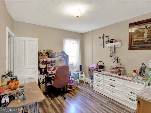 a room with furniture and wooden floor