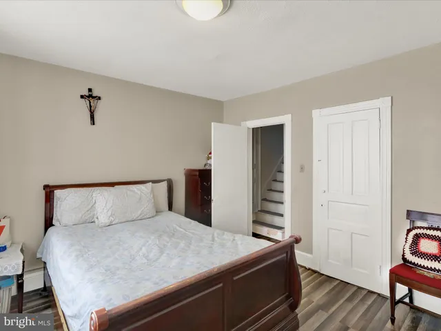 a bedroom with a bed and a chair