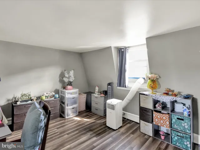 a living room with furniture a rug and a table