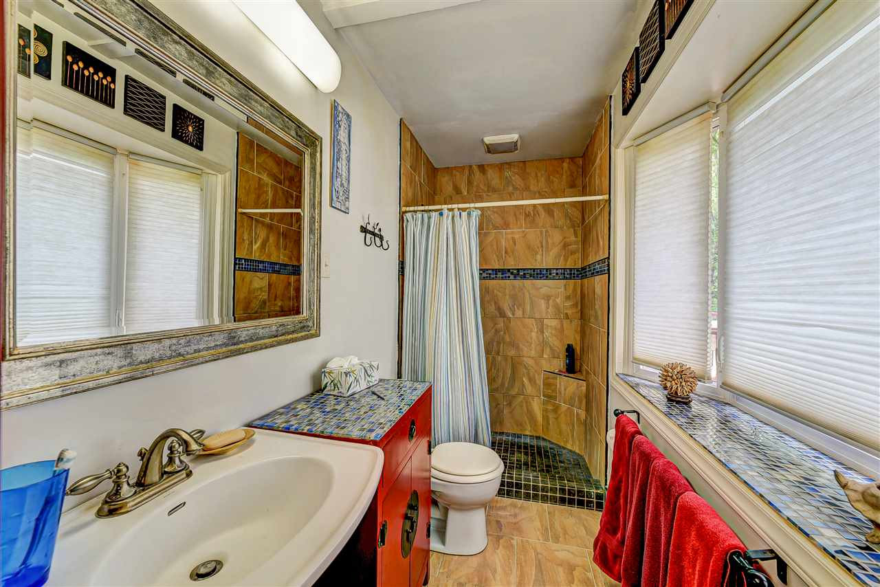 6712 Perkins Drive Raleigh, NC 27612 - Photo 15 of 30 Updated Master Bath with walk in shower, tile flooring and bay style window. Master Bath/Spa