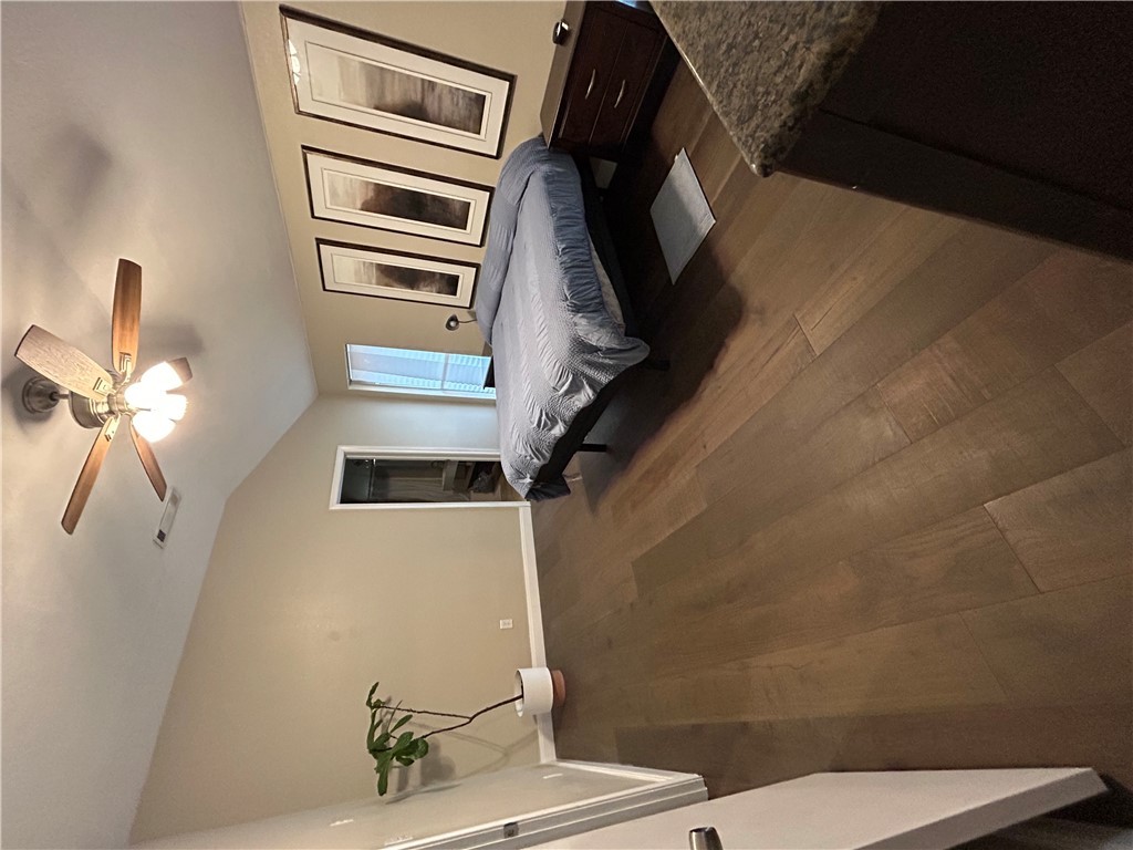 2230 Howell Avenue Bryan, TX 77803 - Photo 14 of 14 a bedroom with a bed and ceiling fan