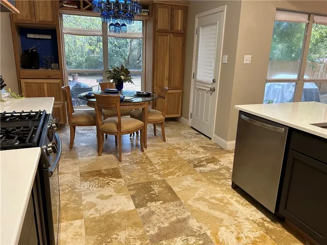 a view of a dining room with furniture window and outside view