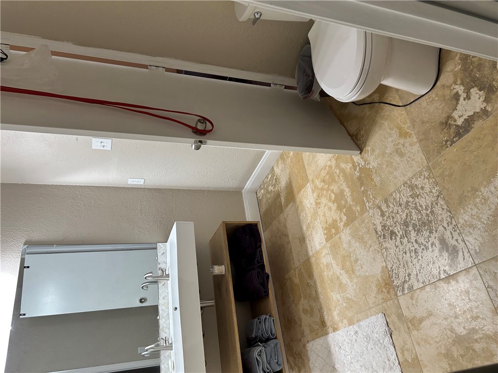 2230 Howell Avenue Bryan, TX 77803 - Photo 10 of 14 a bathroom with a sink toilet and shower