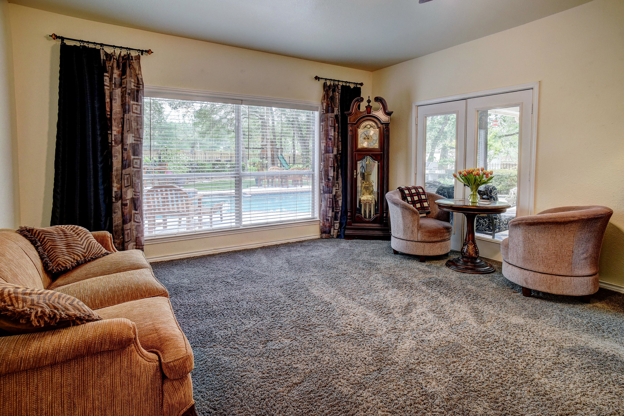 147 Spring Meadow Road Bastrop, TX 78602 - Photo 13 of 40 a living room with furniture and a large window