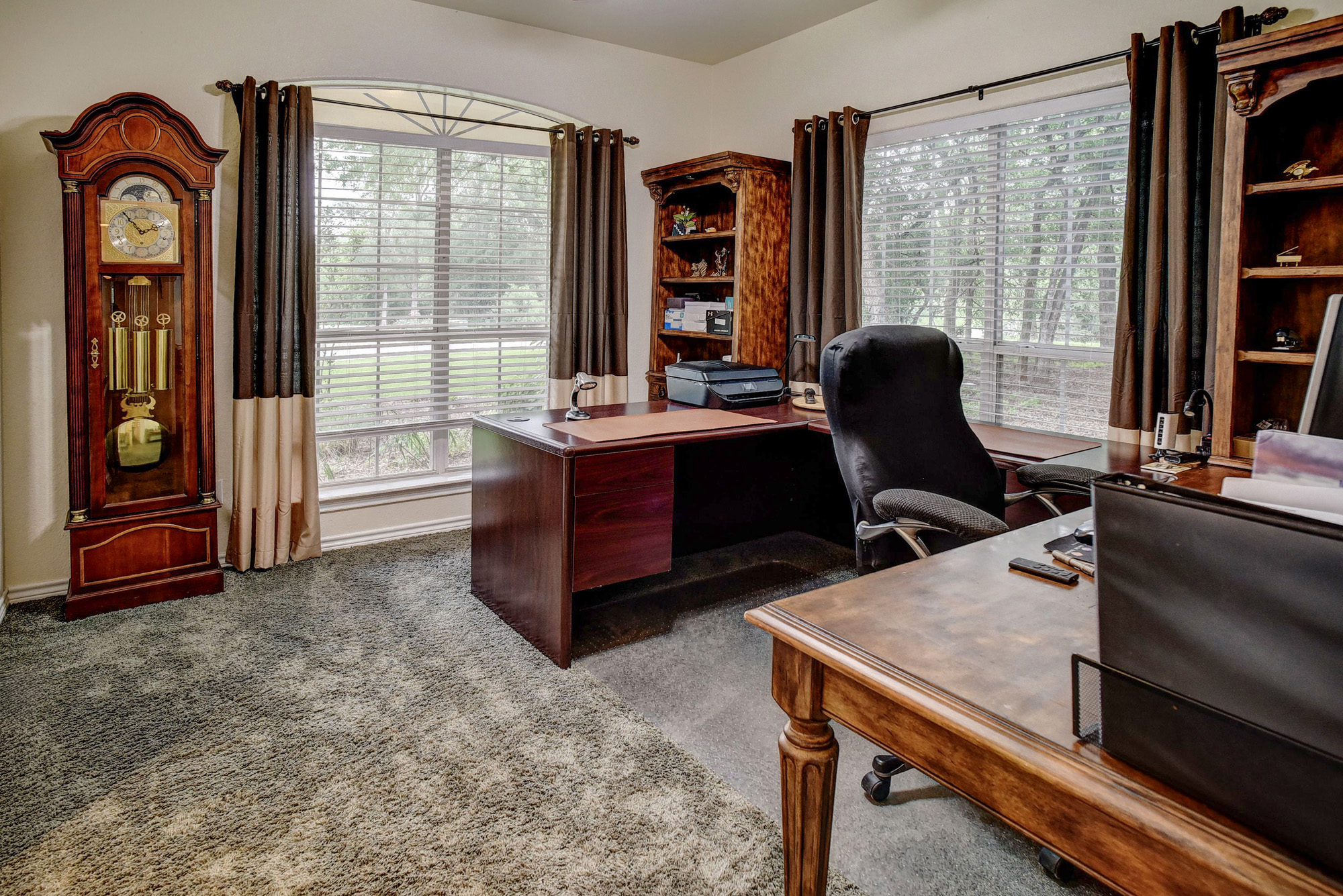 147 Spring Meadow Road Bastrop, TX 78602 - Photo 19 of 40 a view of a workspace with furniture and a window