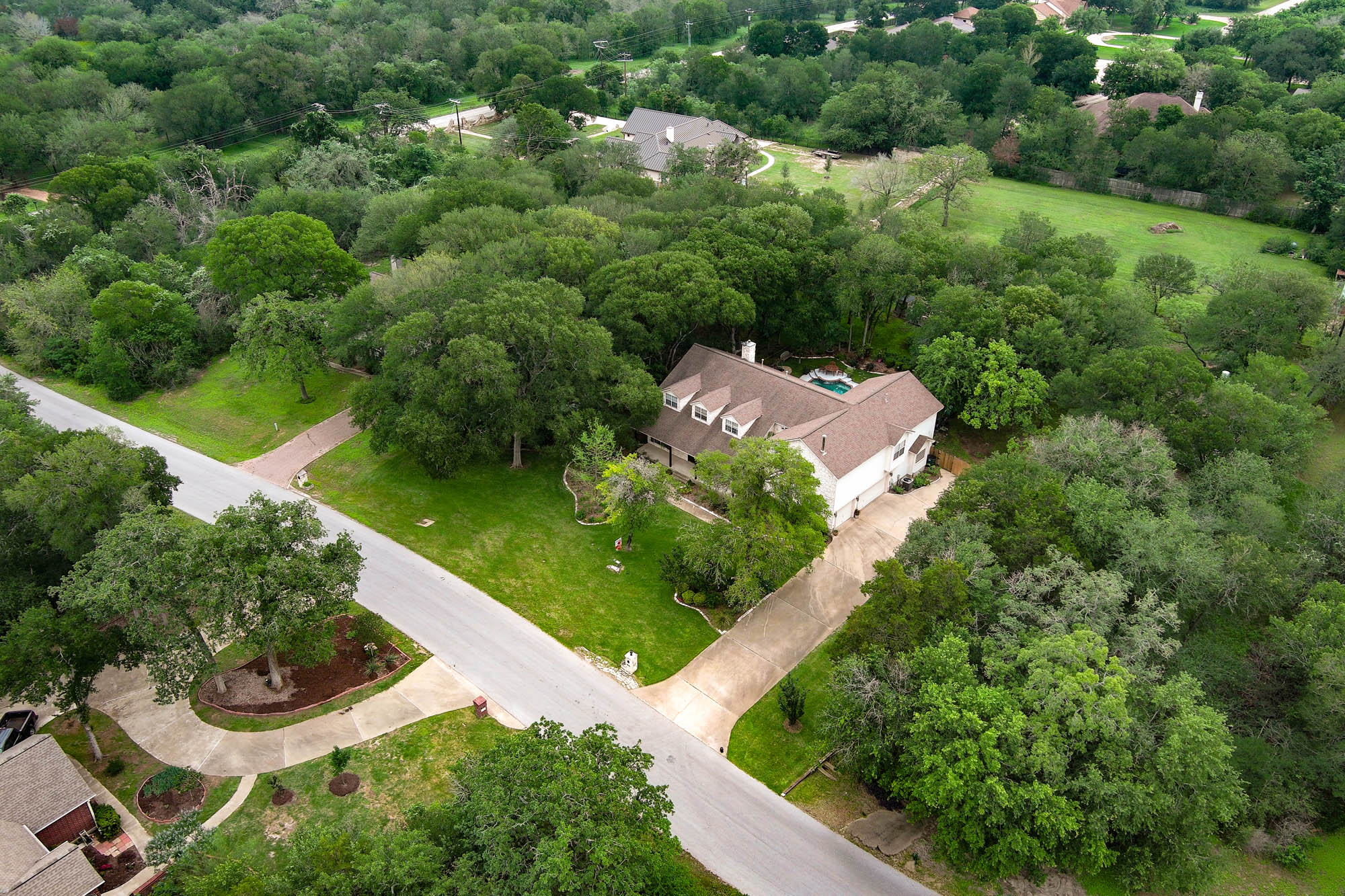147 Spring Meadow Road Bastrop, TX 78602 - Photo 39 of 40 an aerial view of a house with a yard