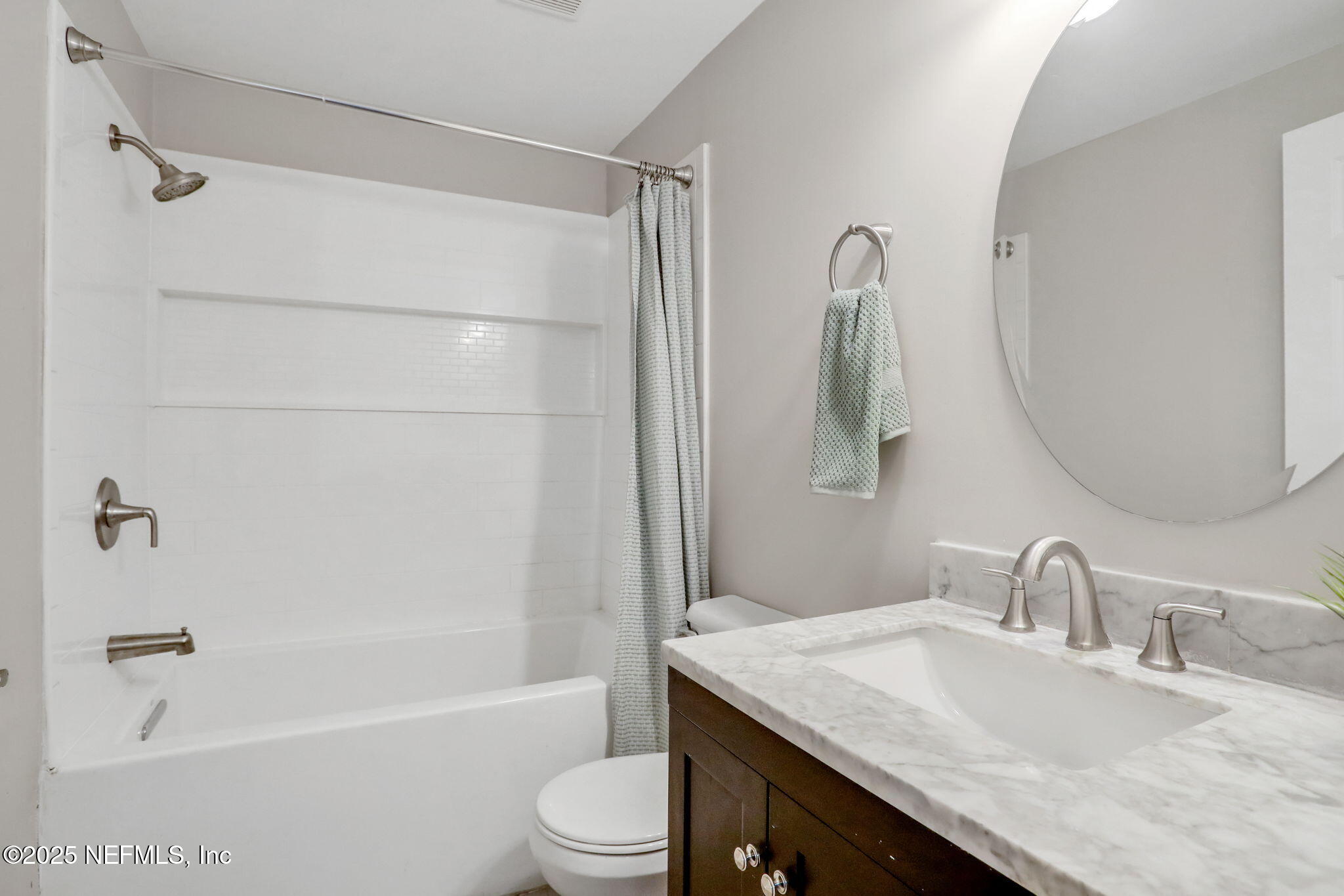 3822 Packard Drive Jacksonville, FL 32246 - Photo 22 of 38 a bathroom with a granite countertop sink a toilet and shower