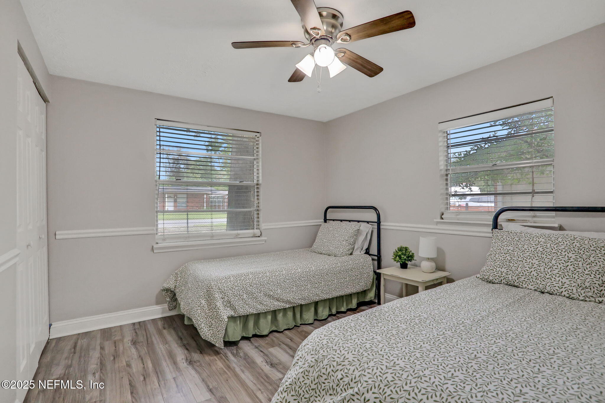 3822 Packard Drive Jacksonville, FL 32246 - Photo 23 of 38 a bedroom with two beds and painting on the wall