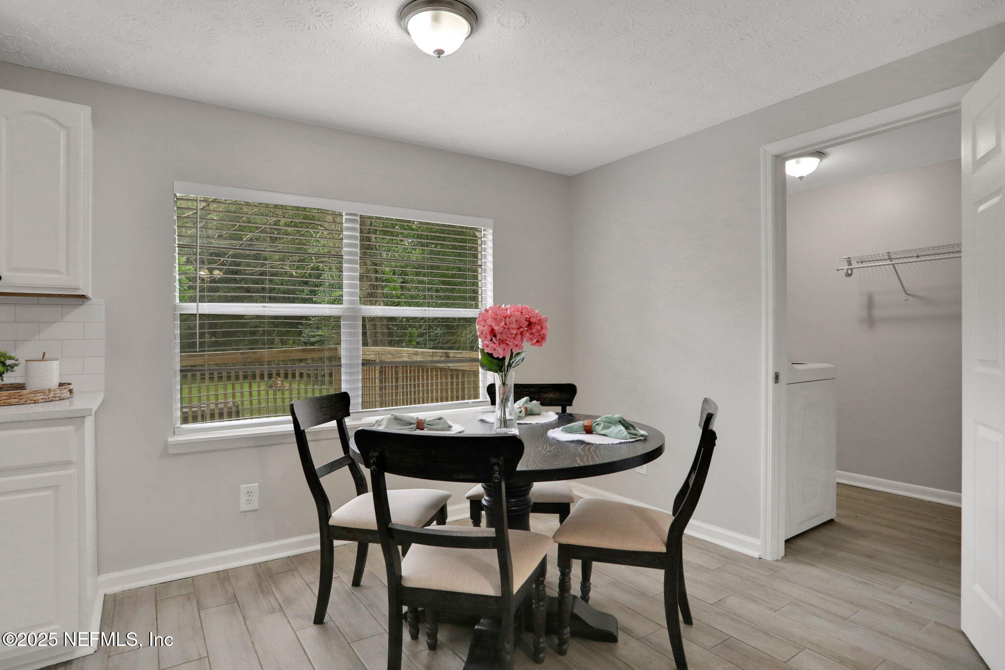 3822 Packard Drive Jacksonville, FL 32246 - Photo 9 of 38 a dining room with furniture and wooden floor