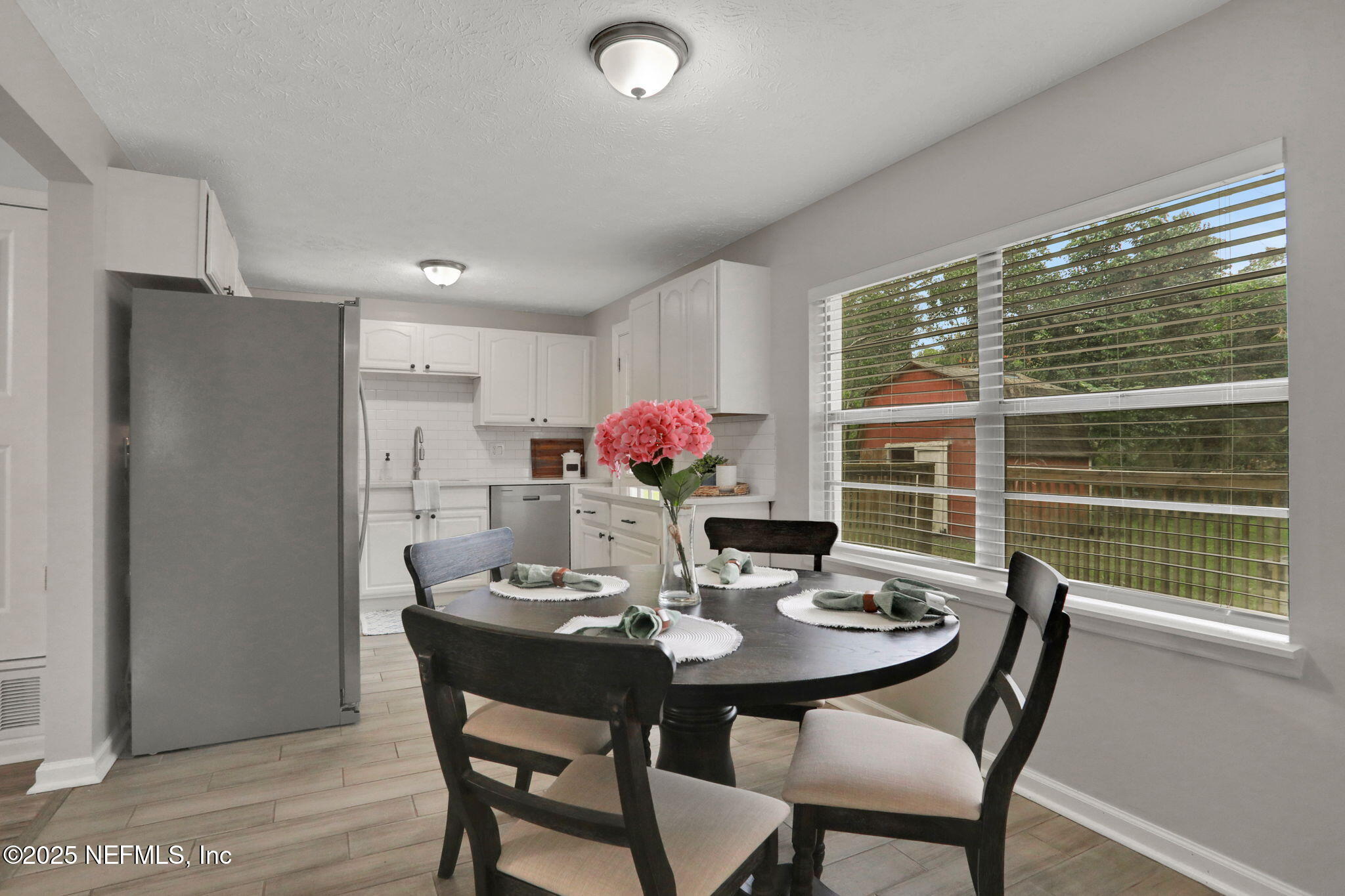 3822 Packard Drive Jacksonville, FL 32246 - Photo 10 of 38 a dining room with furniture and window