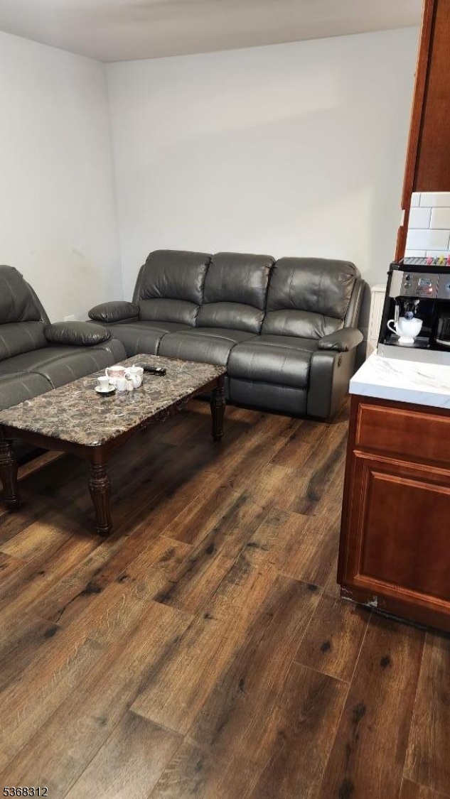 522 Chestnut Street, Unit 2 Orange, NJ 07050 - Photo 6 of 8 a living room with furniture and a couch