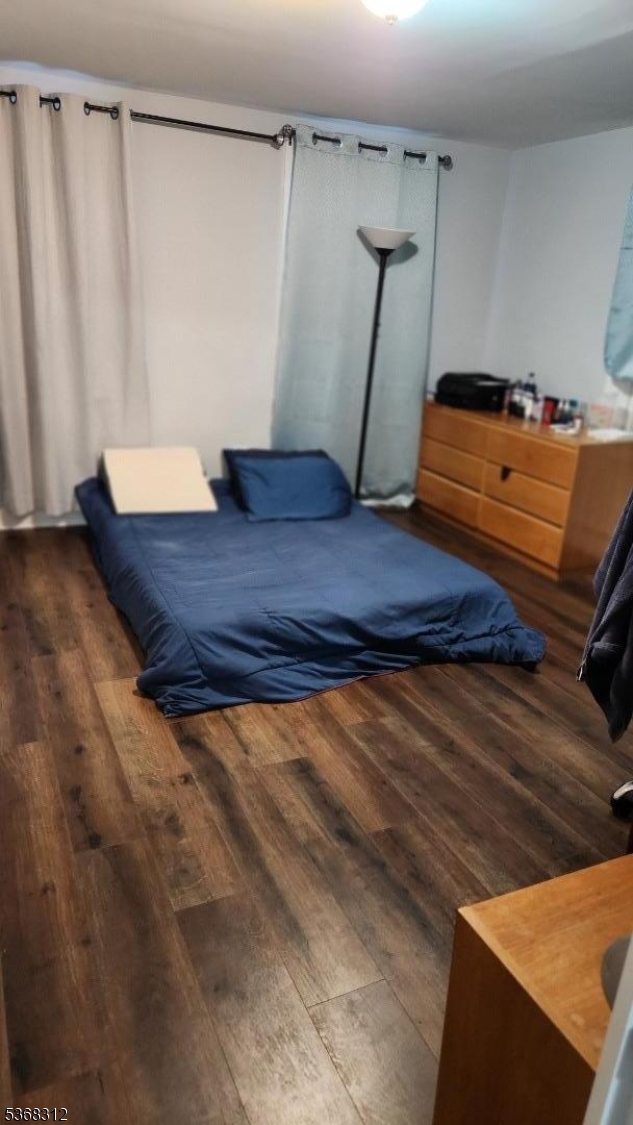 522 Chestnut Street, Unit 2 Orange, NJ 07050 - Photo 8 of 8 a room with a bed