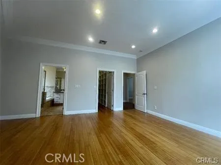 a view of hallway with wooden floor