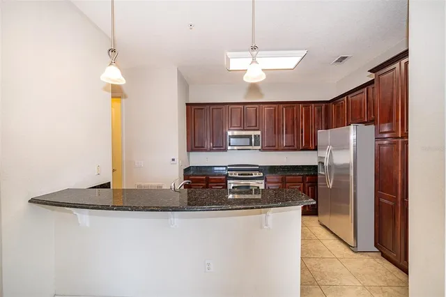 a view of a kitchen with a sink and a microwave