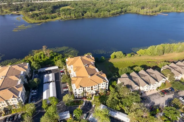 an aerial view of residential house with outdoor space and swimming pool