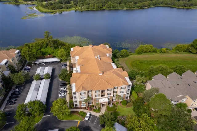 an aerial view of a house with garden space and outdoor seating