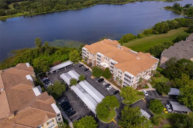an aerial view of a house with garden space and street view