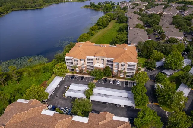 an aerial view of a house with garden space and street view