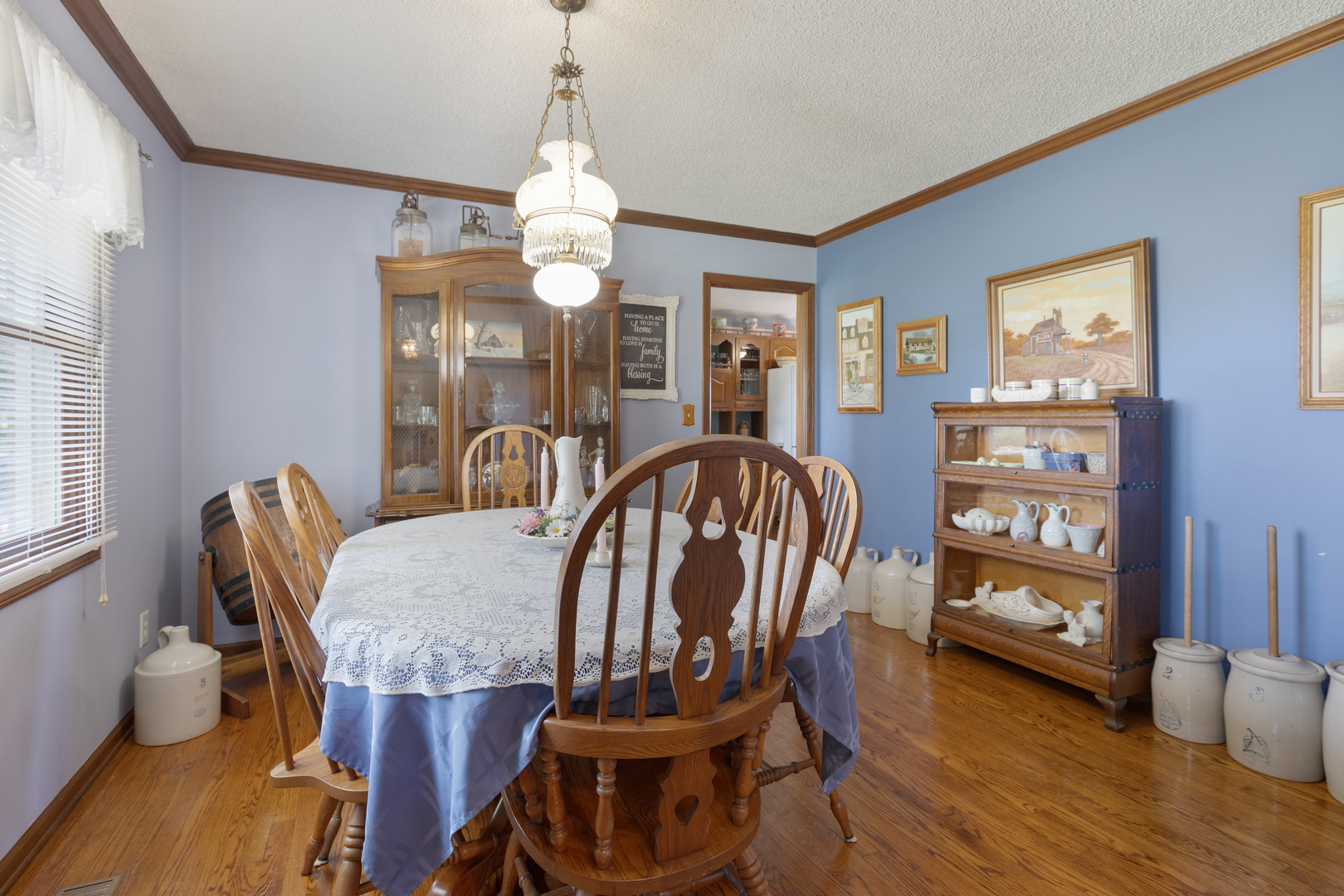 50W424 Plank Road Sycamore, IL 60178 - Photo 13 of 22 a view of a dining room with furniture and wooden floor