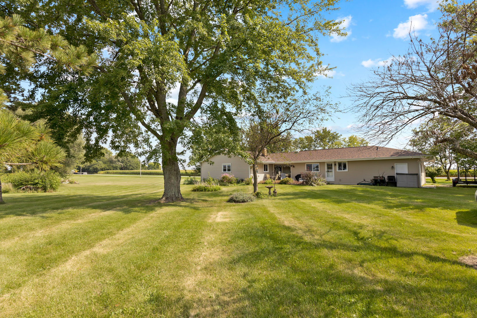 50W424 Plank Road Sycamore, IL 60178 - Photo 21 of 22 a view of a house with a big yard and large trees