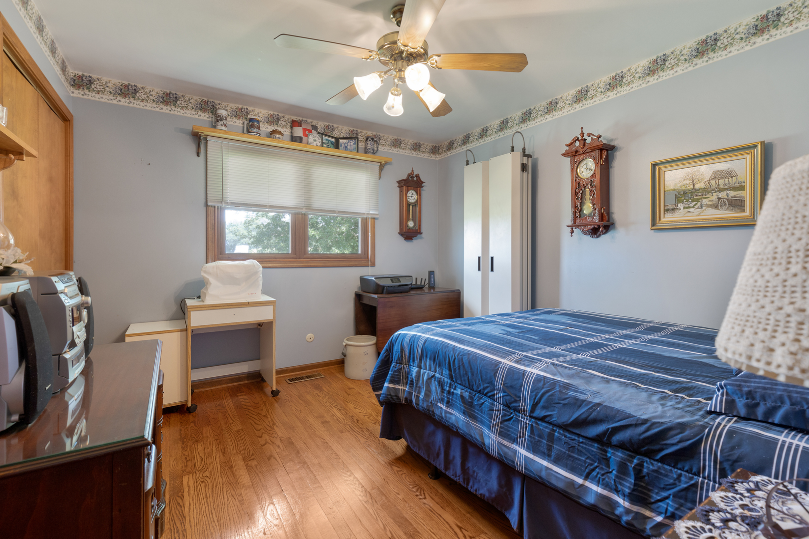 50W424 Plank Road Sycamore, IL 60178 - Photo 22 of 22 a bedroom with a bed and a chandelier
