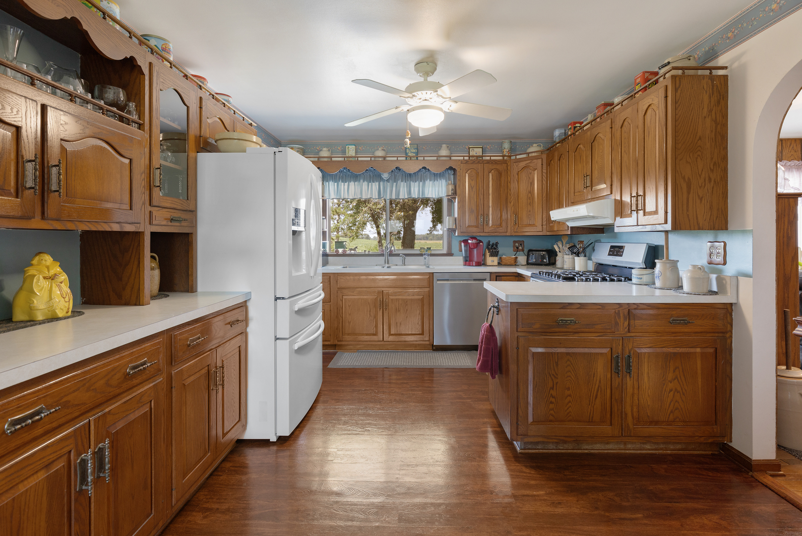 50W424 Plank Road Sycamore, IL 60178 - Photo 5 of 22 a kitchen with stainless steel appliances granite countertop a sink a stove cabinets and wooden floor