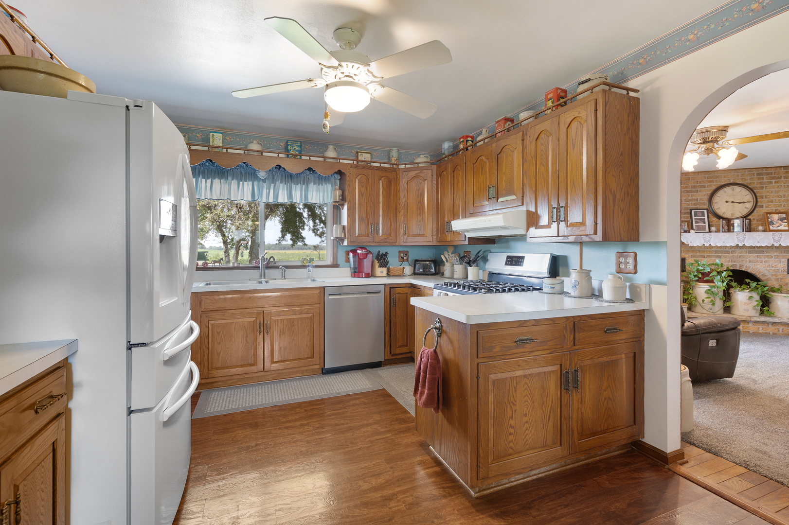 50W424 Plank Road Sycamore, IL 60178 - Photo 7 of 22 a kitchen with a sink cabinets stainless steel appliances and a window