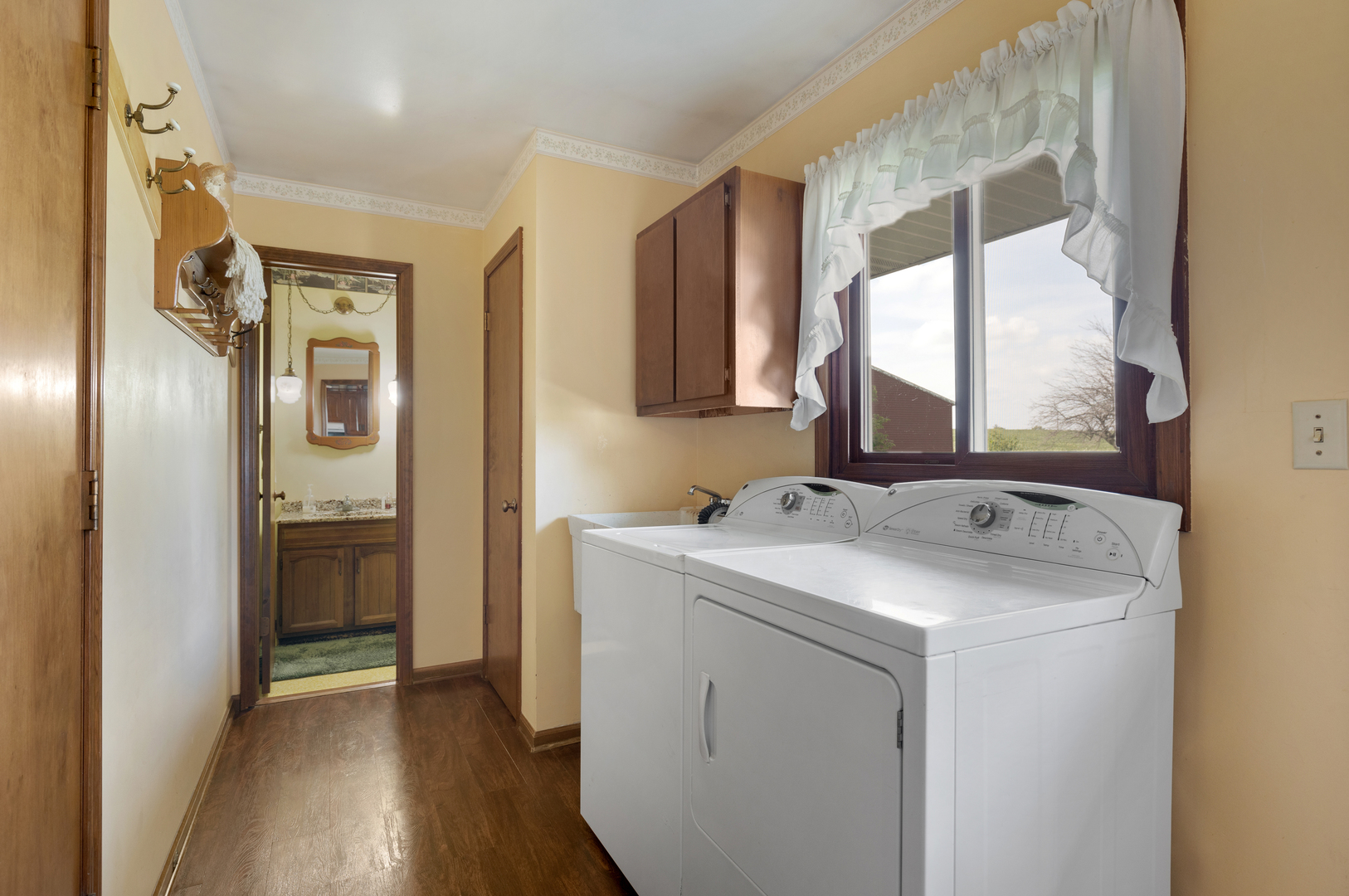 50W424 Plank Road Sycamore, IL 60178 - Photo 10 of 22 a view of hallway with washer and dryer