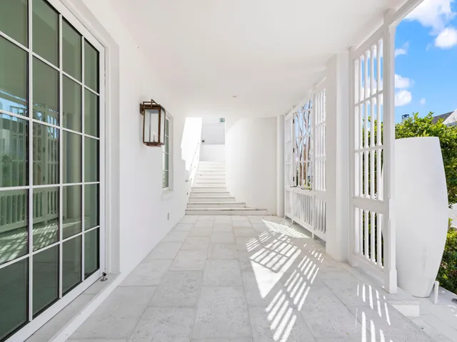a view of a living room and hallway with wooden floor