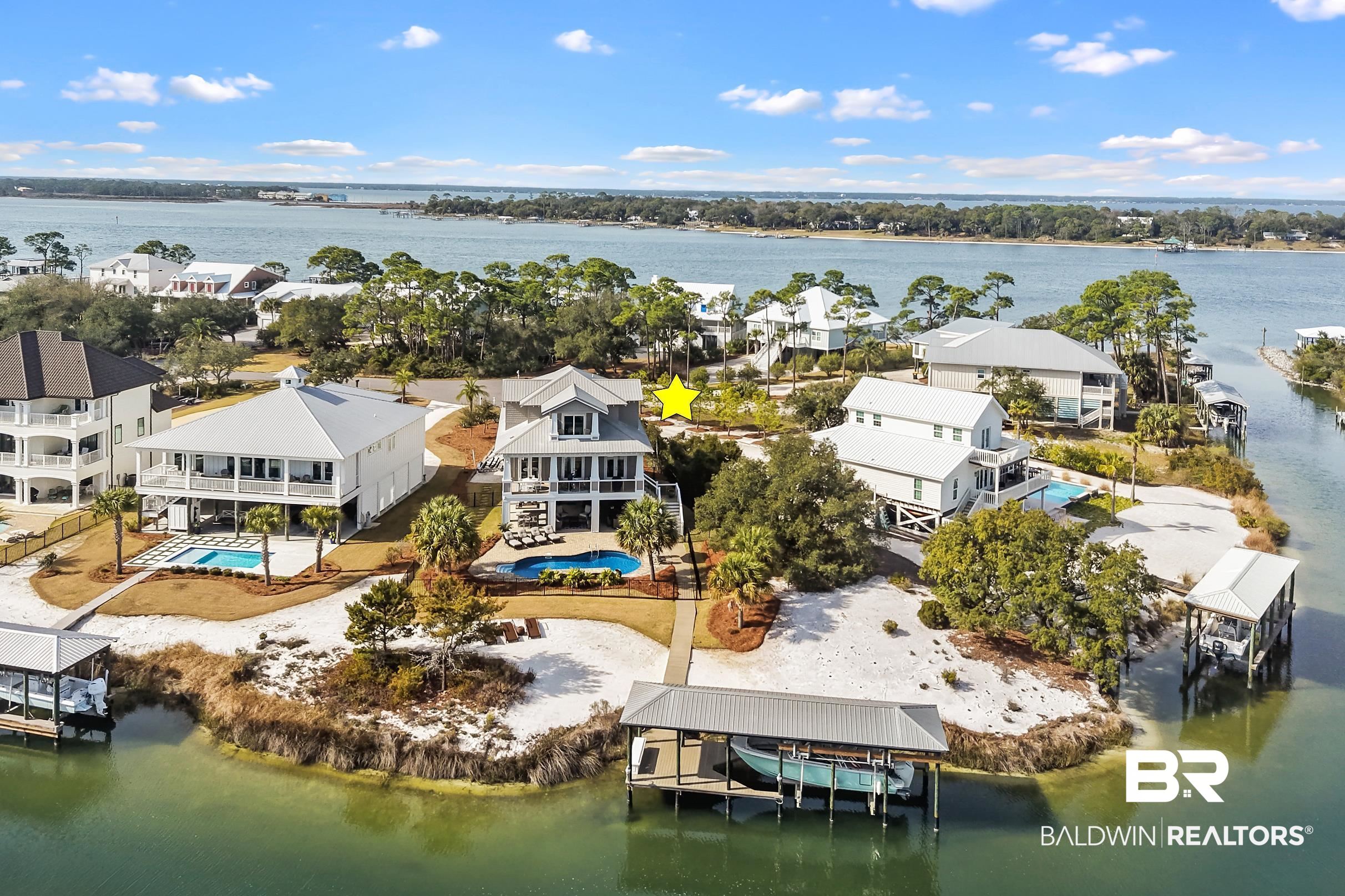 33186 Marlin Key Drive Orange Beach, AL 36561 - Photo 3 of 87 Aerial perspective of suburban area featuring a nearby body of water
