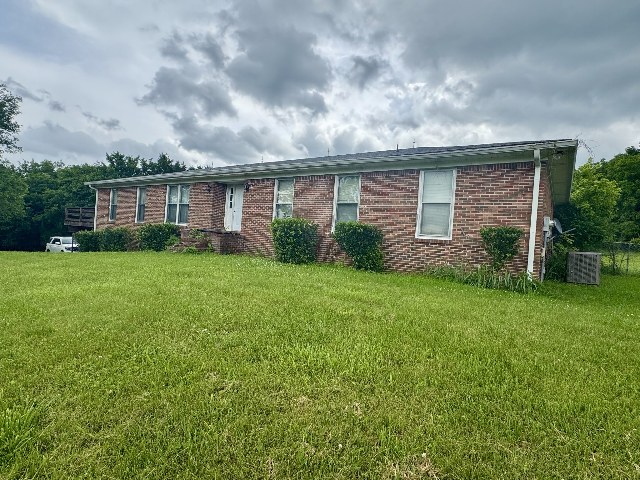 0 Rawls Creek Road Gordonsville, TN 38563 - Photo 2 of 12 a view of a house next to a yard with plants and trees