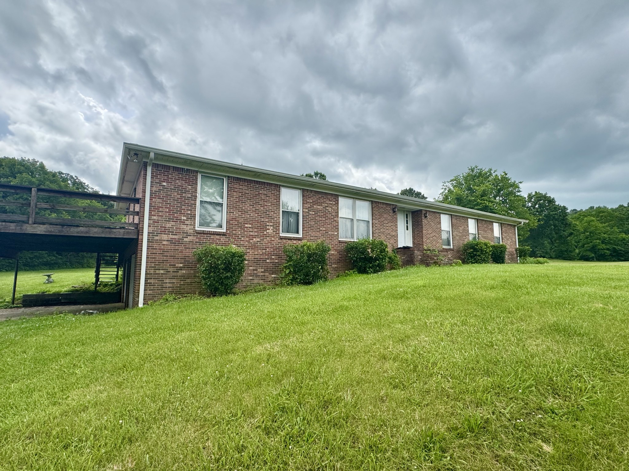0 Rawls Creek Road Gordonsville, TN 38563 - Photo 3 of 12 a front view of a house with a yard