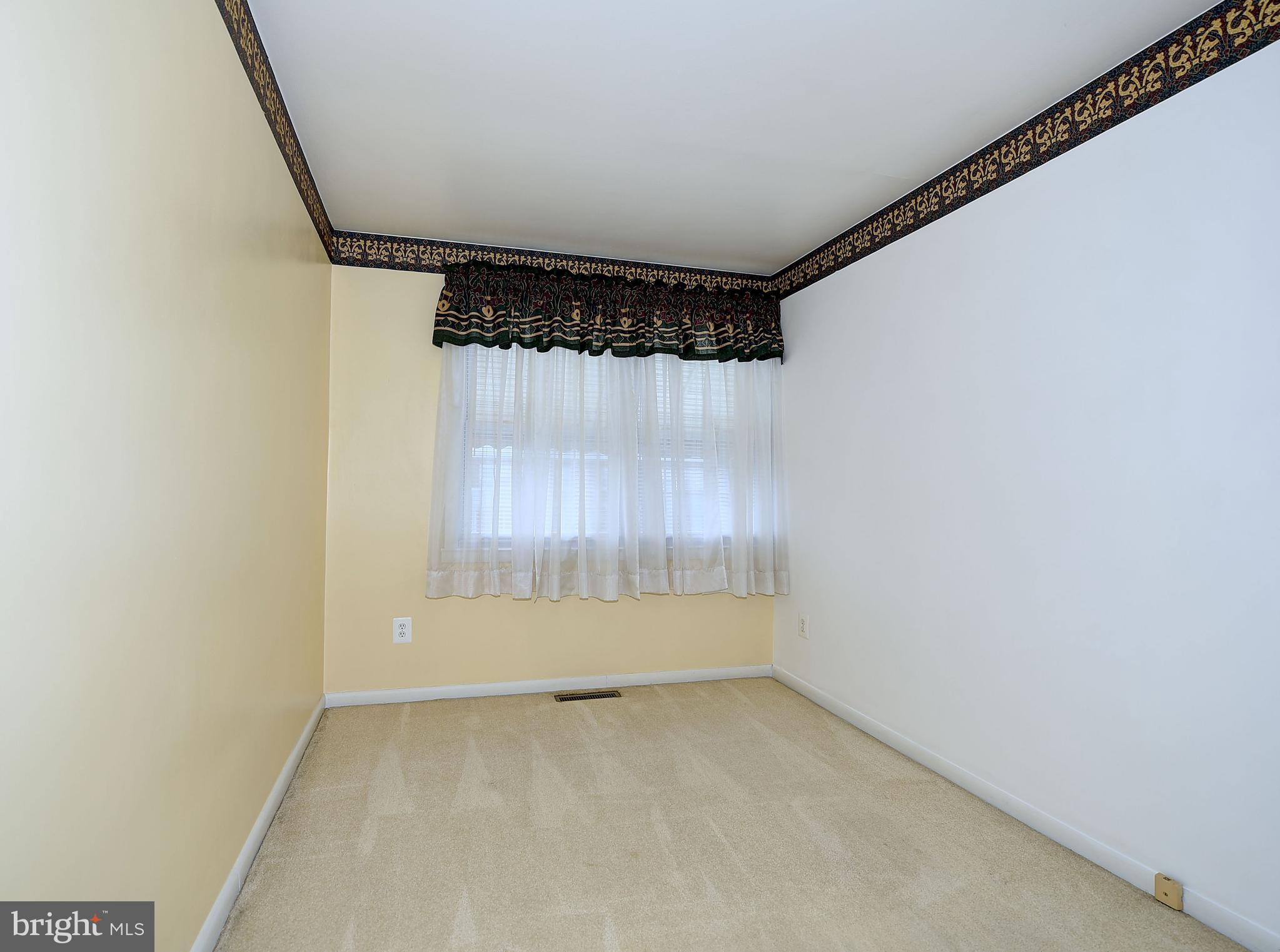 8108 Mid Haven Road Baltimore, MD 21222 - Photo 18 of 28 an empty room with a window