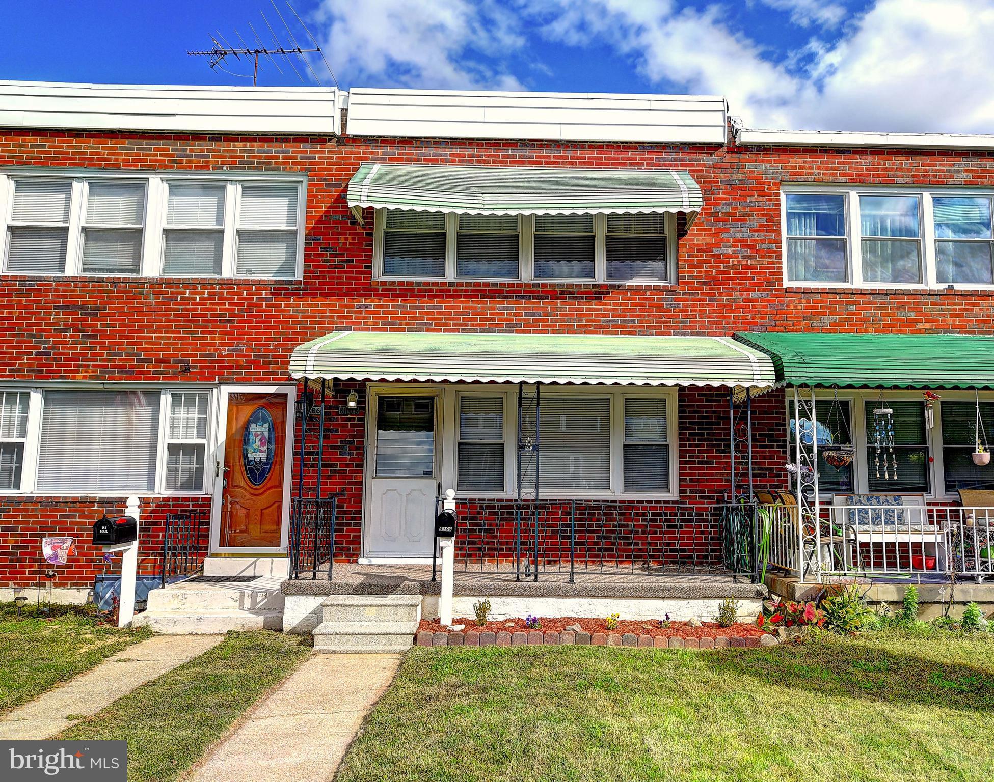 8108 Mid Haven Road Baltimore, MD 21222 - Photo 21 of 28 front view of a brick building with a yard