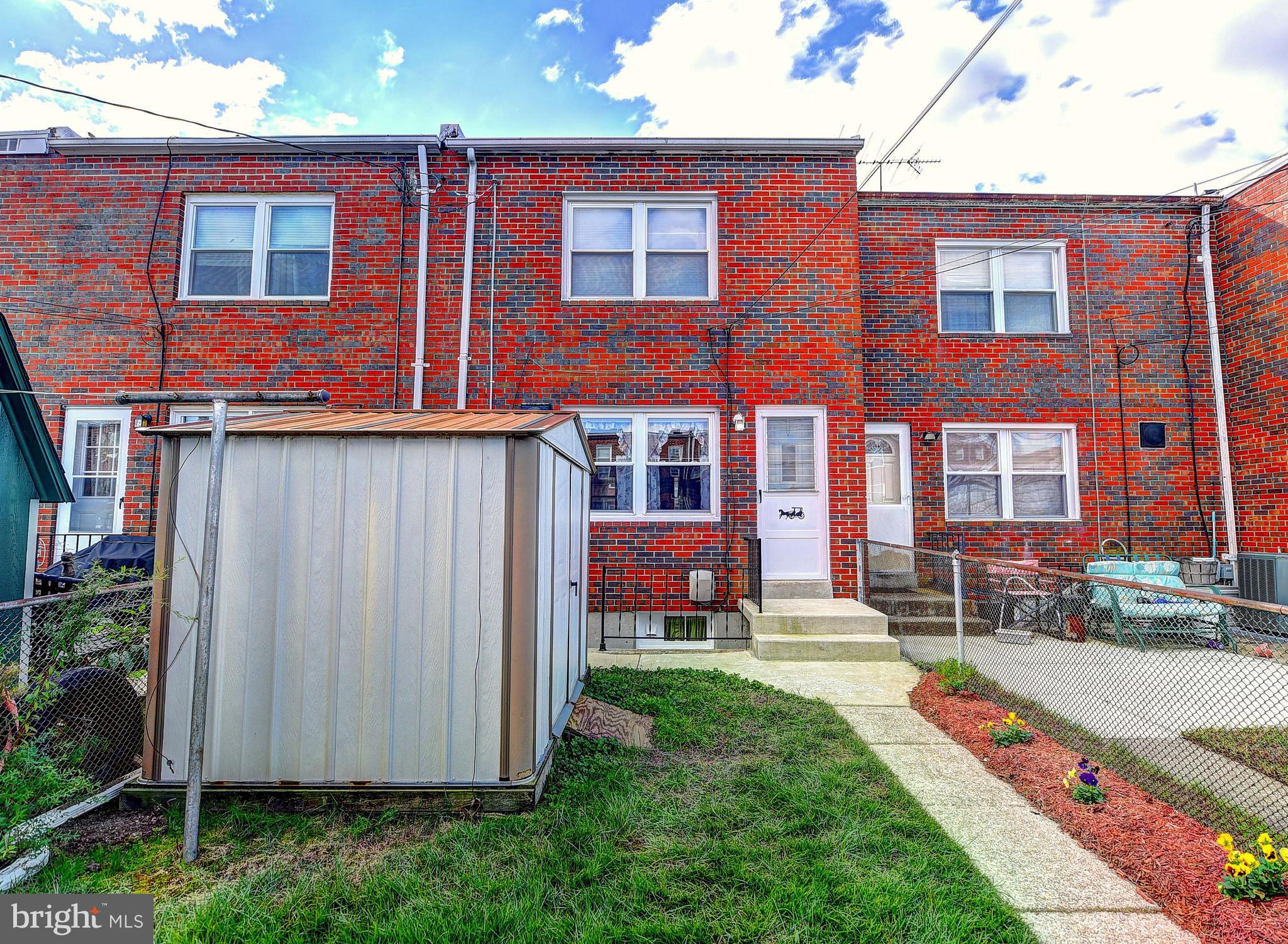 8108 Mid Haven Road Baltimore, MD 21222 - Photo 26 of 28 a front view of a house with yard