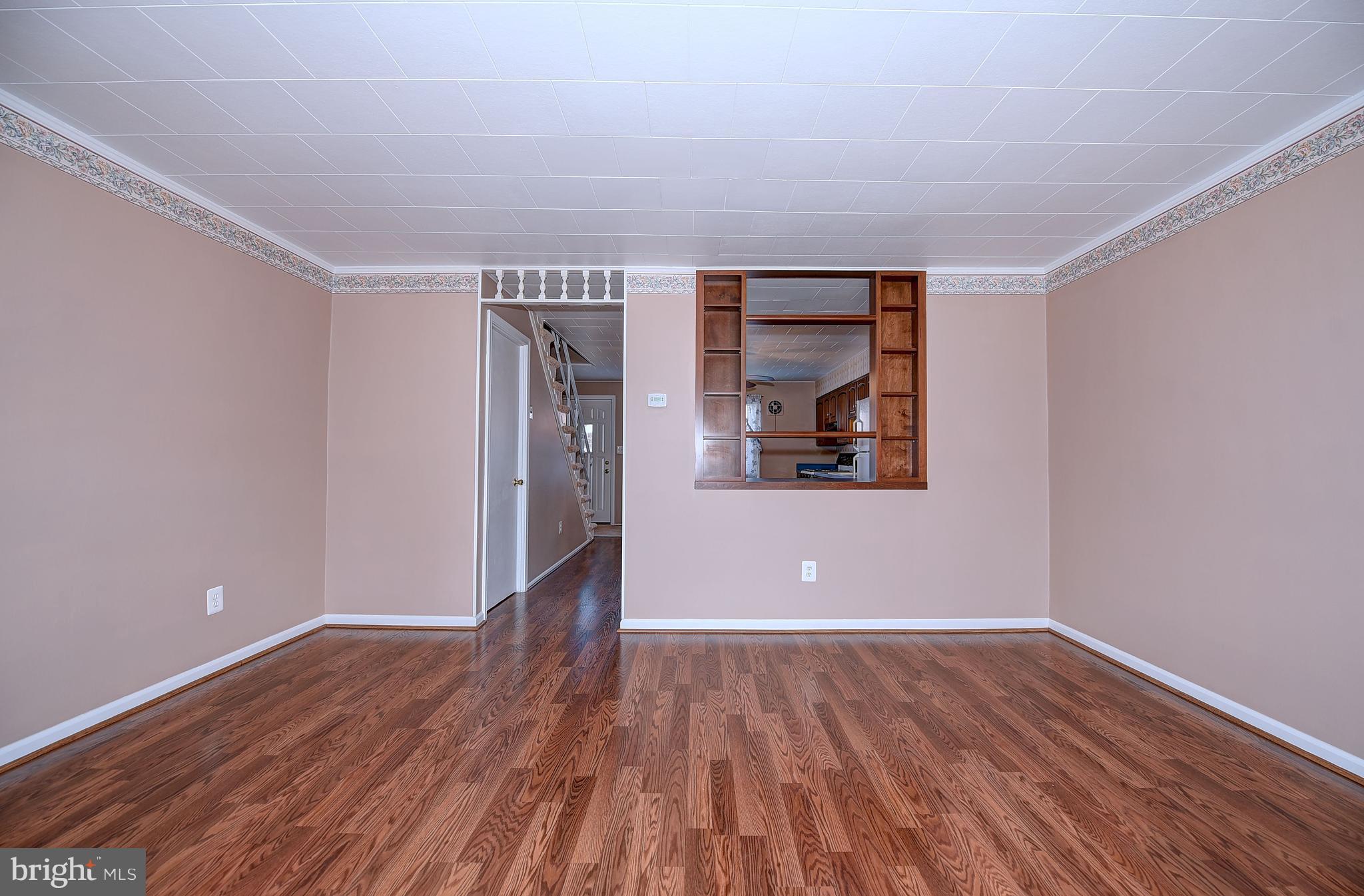 8108 Mid Haven Road Baltimore, MD 21222 - Photo 5 of 28 wooden floor in a empty room