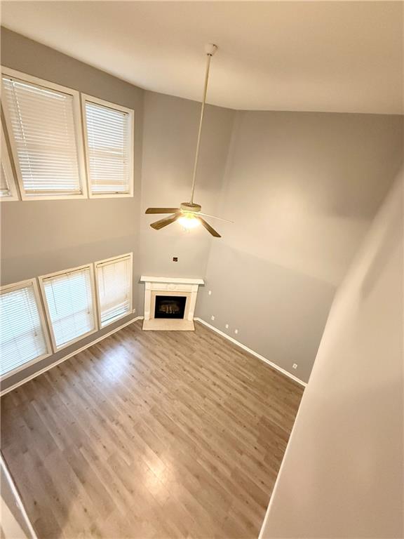 2443 Walnut Tree Lane Buford, GA 30519 - Photo 2 of 15 a view of empty room with wooden floor and fan