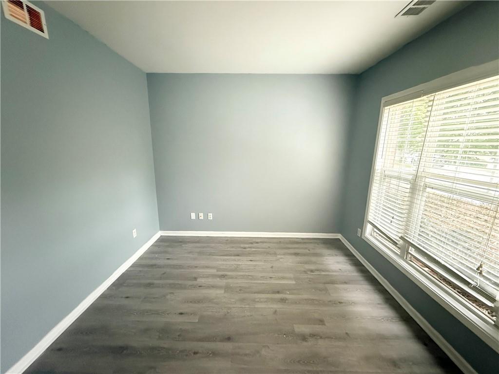 2443 Walnut Tree Lane Buford, GA 30519 - Photo 4 of 15 a view of an empty room and a window