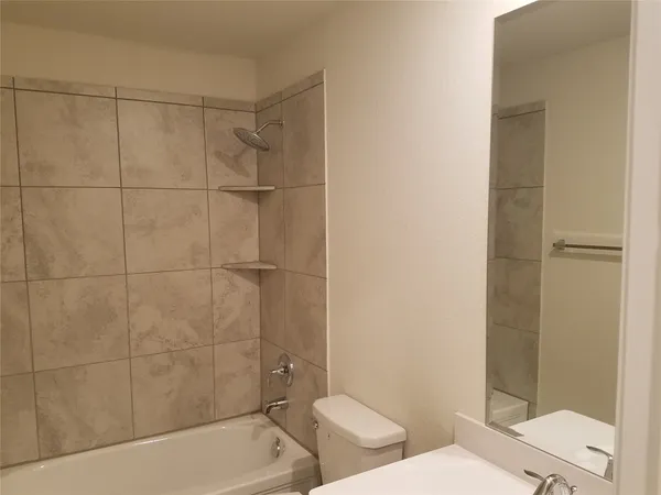 a view of a bathroom from a hallway