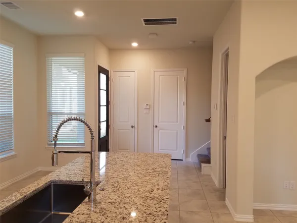 a bedroom with a bed and a cabinets